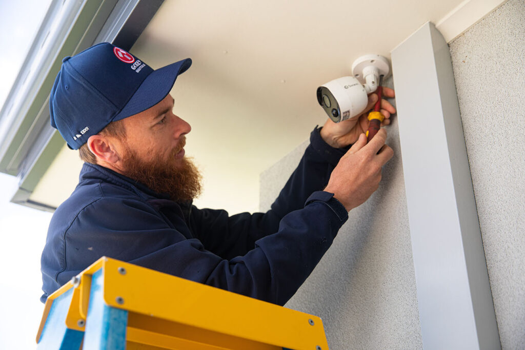 A diligent Gorey electrical employee carefully installing a CCTV system