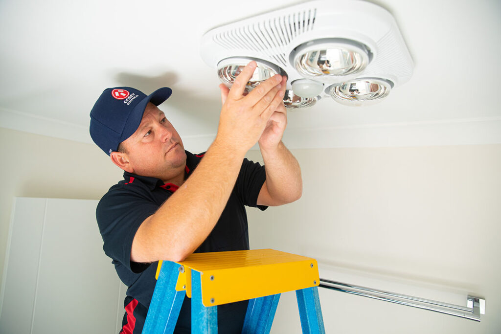 Electrician installing lighting