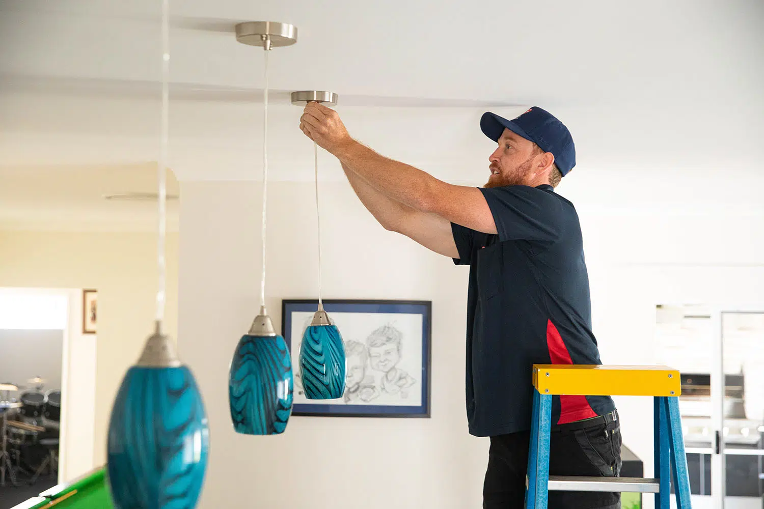 Electrician installing lighting
